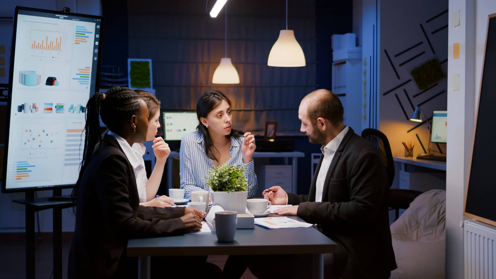 Executive manager woman explaining management statistics working at company strategy overtime in office meeting room.